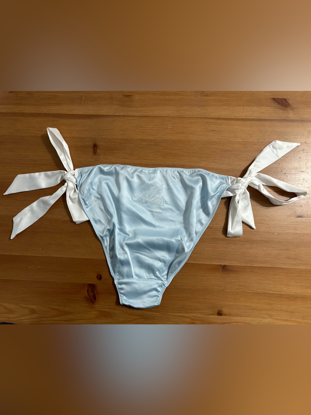 Victoria's Secret cheeky bridal
"Mrs.” Side tie panty in white and baby blue